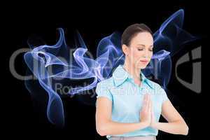 Composite image of peaceful young businesswoman praying