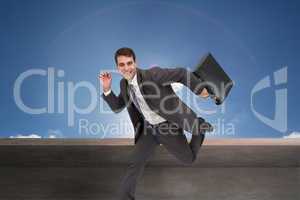 Composite image of cheerful businessman in a hury