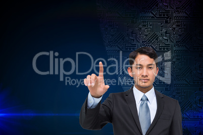 Composite image of stern asian businessman pointing