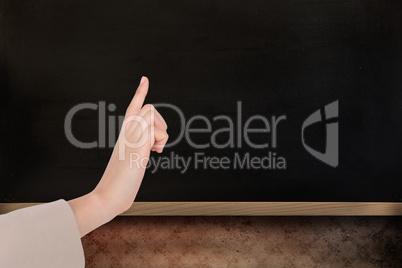 Composite image of businesswoman pointing