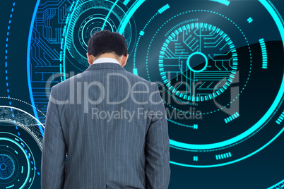 Composite image of businessman standing