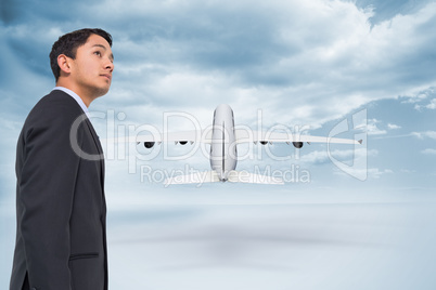 Composite image of serious asian businessman