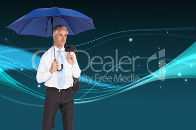 Composite image of happy businessman holding umbrella