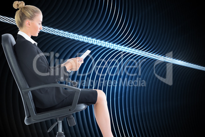 Composite image of businesswoman sitting on swivel chair with ta Composite image of businesswoman sitting on swivel chair with ta