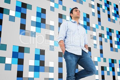 Composite image of unsmiling casual man standing