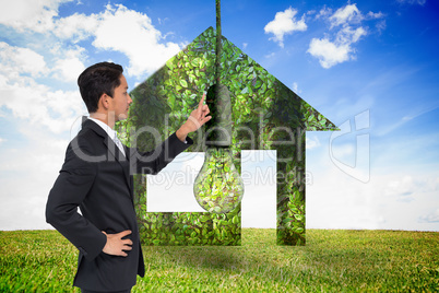 Composite image of unsmiling asian businessman pointing