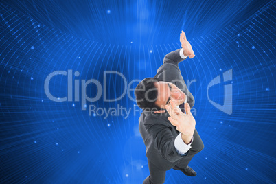 Composite image of unsmiling businessman with arms raised