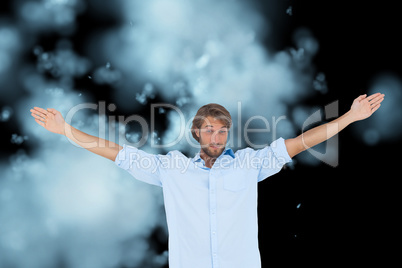 Composite image of handsome man raising hands