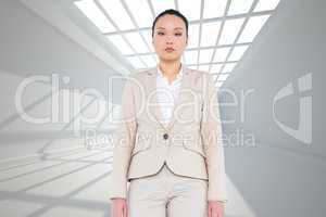 Composite image of unsmiling asian businesswoman walking