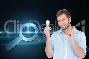 Composite image of charming model holding a bulb in right hand