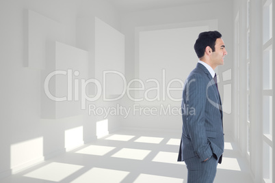 Composite image of smiling businessman standing