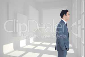 Composite image of smiling businessman standing