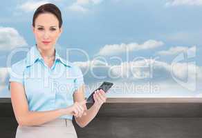 Composite image of serious classy businesswoman using calculator