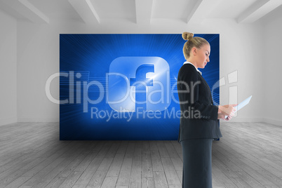 Composite image of businesswoman holding new tablet