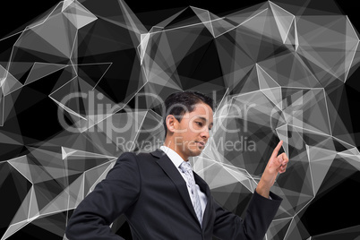 Composite image of unsmiling asian businessman pointing