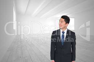 Composite image of smiling asian businessman