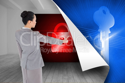 Composite image of unsmiling asian businesswoman pointing