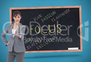 Composite image of attractive businesswoman holding tablet pc