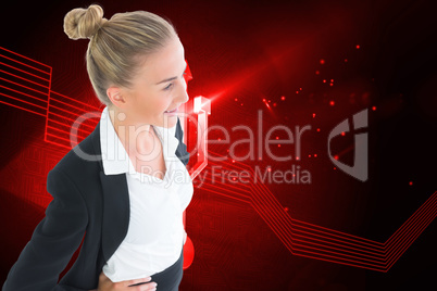 Composite image of businesswoman standing with hands on hips