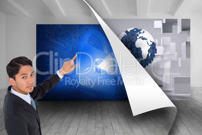 Composite image of serious asian businessman pointing