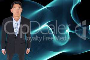 Composite image of serious asian businessman