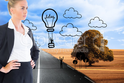 Composite image of businesswoman standing with hands on hips