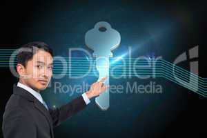 Composite image of stern asian businessman pointing