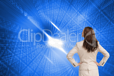 Composite image of businesswoman standing back to camera