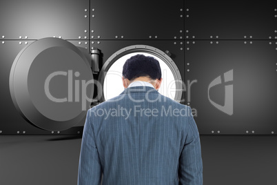 Composite image of businessman standing