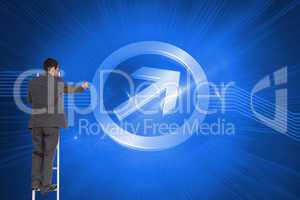 Composite image of businessman standing on ladder