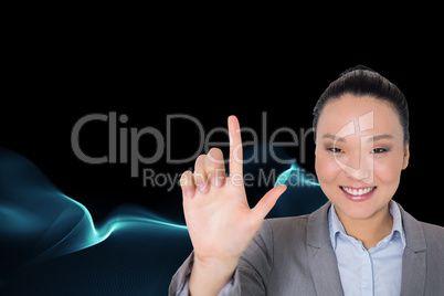 Composite image of smiling asian businesswoman pointing