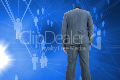 Composite image of businessman standing