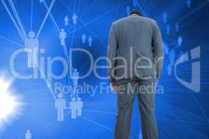 Composite image of businessman standing