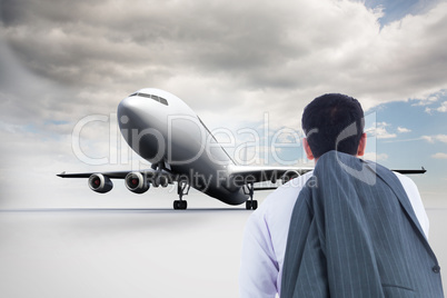 Composite image of businessman standing