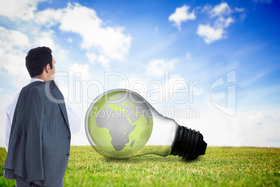 Composite image of businessman standing