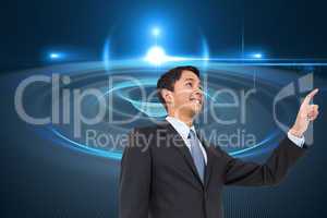 Composite image of smiling asian businessman pointing