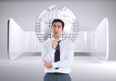 Composite image of thinking businessman holding glasses