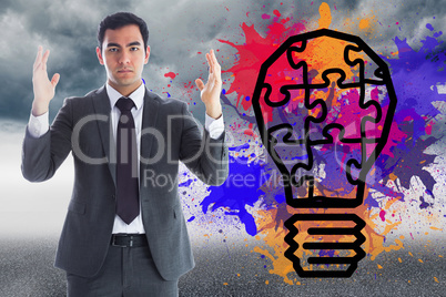 Composite image of unsmiling businessman with arms raised