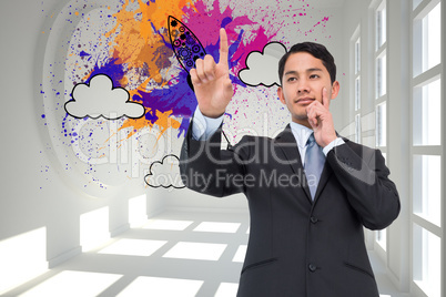 Composite image of thoughtful asian businessman pointing