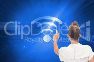 Composite image of businesswoman touching something