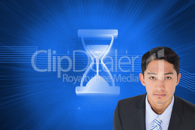 Composite image of serious asian businessman