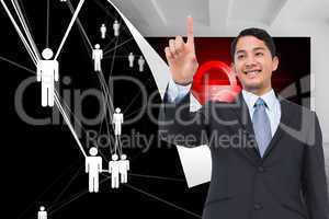 Composite image of smiling asian businessman pointing