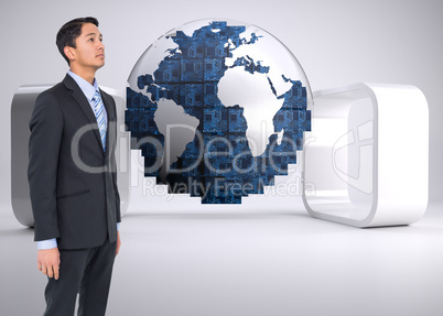 Composite image of serious asian businessman