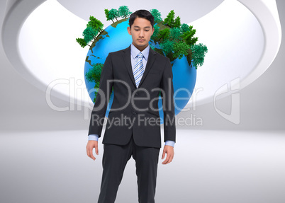 Composite image of serious asian businessman