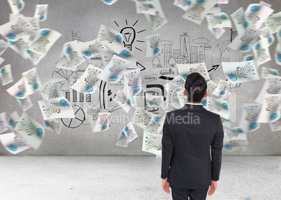 Composite image of businessman turning his back to camera