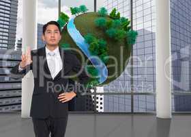 Composite image of unsmiling asian businessman pointing