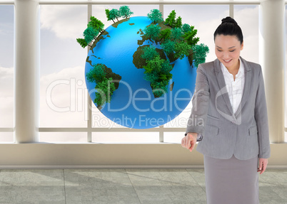 Composite image of smiling asian businesswoman pointing