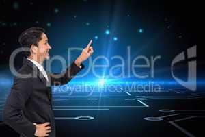 Composite image of smiling asian businessman pointing