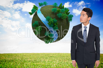 Composite image of serious asian businessman