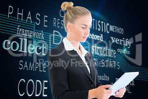 Composite image of businesswoman holding tablet